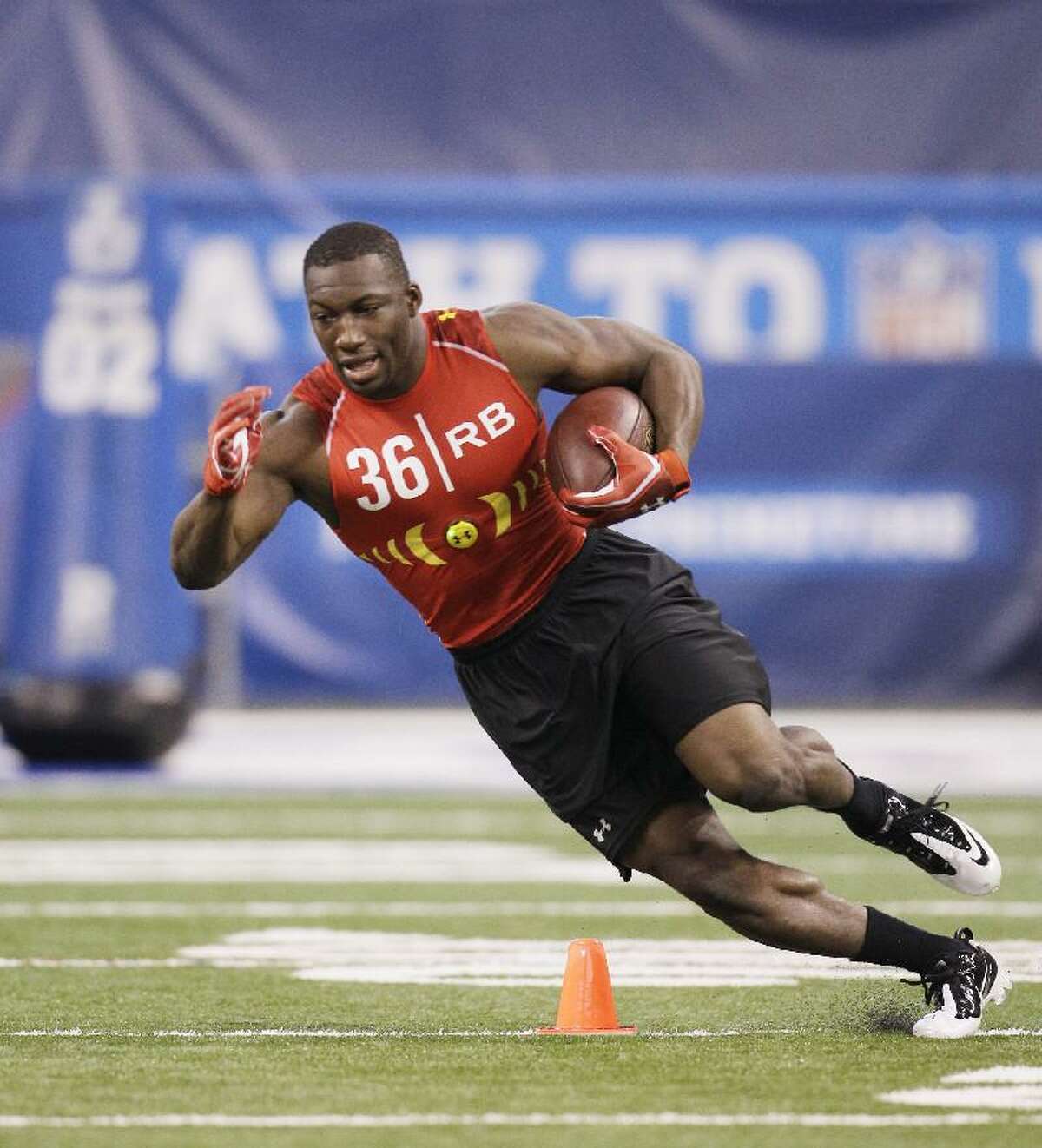 ASSOCIATED PRESS Connecticut running back Jordan Todman runs a drill during the NFL football scouting combine in Indianapolis on Feb. 27.