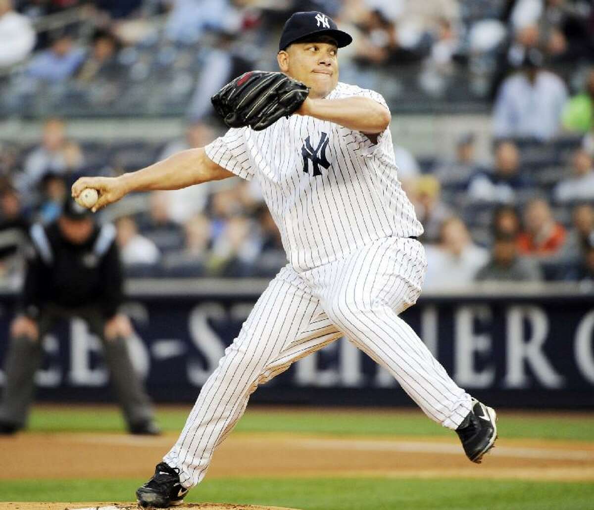 ASSOCIATED PRESS New York Yankees pitcher Bartolo Colon delivers the ball to the Chicago White Sox during the first inning of Wednesday's game at Yankee Stadium in New York. Colon got the win as the Yankees defeated the White Sox 3-1.