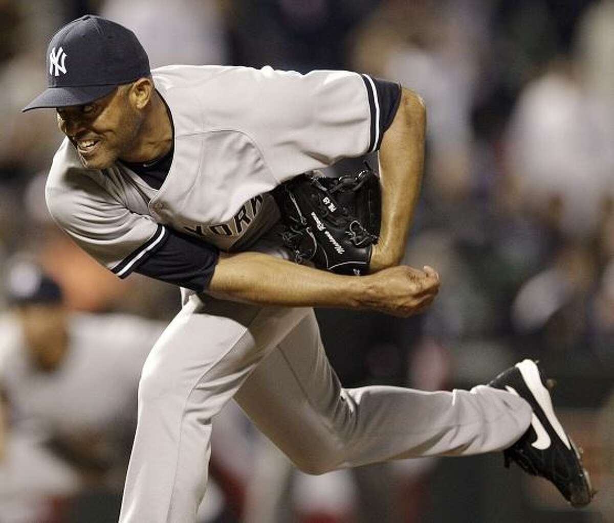 New York Yankees relief pitcher Mariano Rivera follows through on a pitch against the Baltimore Orioles in the twelfth inning of a baseball game in Baltimore, Tuesday, April 10, 2012. New York won 5-4. (AP Photo/Patrick Semansky)