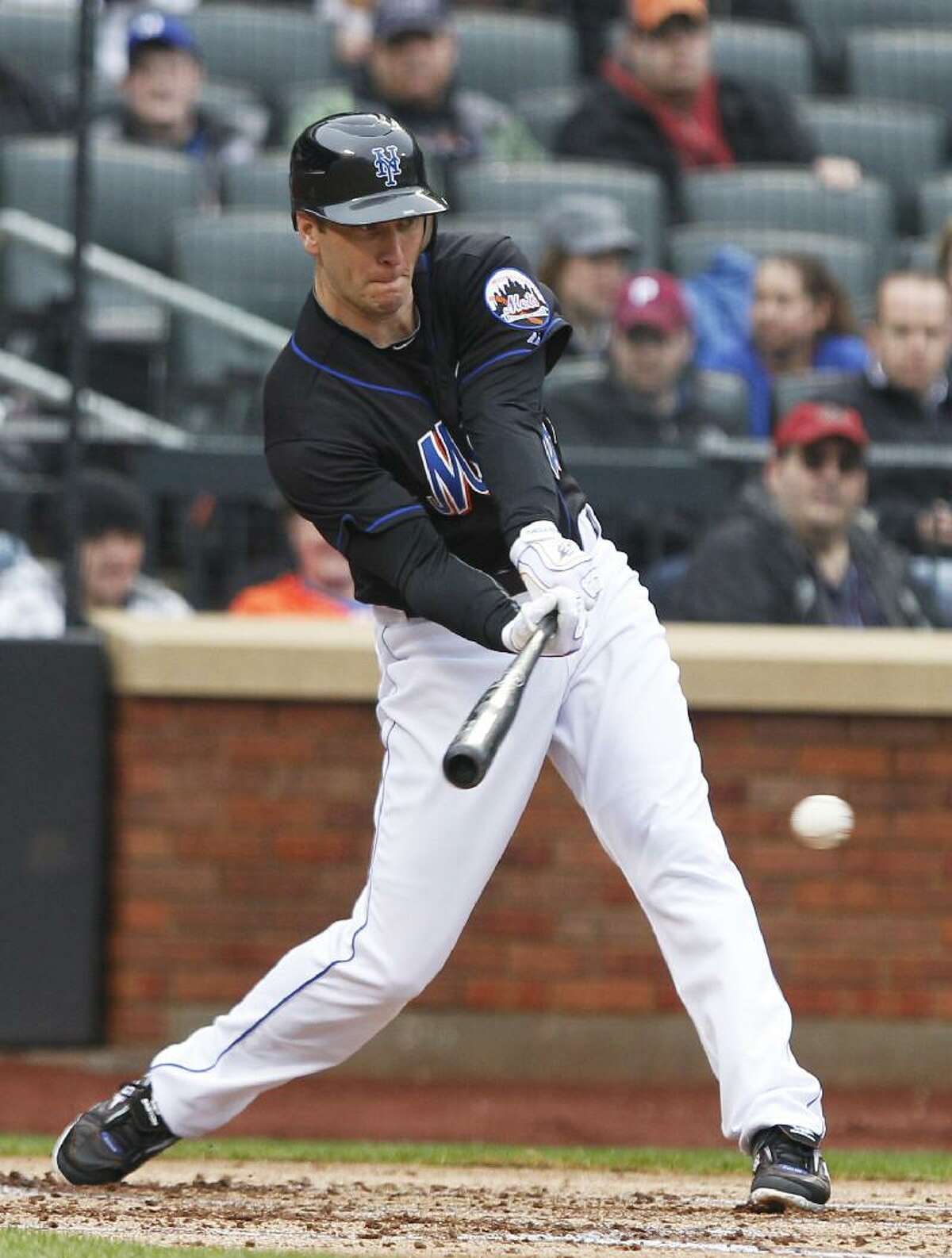 ASSOCIATED PRESS New York's Jason Bay follows through on a two-run single during the first inning of Saturday's game at CitiField in New York. Bay also homered in the game, won by the Mets 6-4.