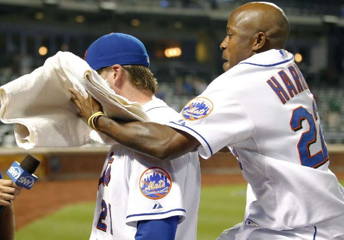 Lucas_Duda_WEB ASSOCIATED PRESS New York Mets' Willie Harris (22) hits teammate Lucas Duda in the face with a towel of shaving cream after Duda drove in the winning run in the inning of Monday's game against the San Diego Padres in New York. The Mets won 9-8.
