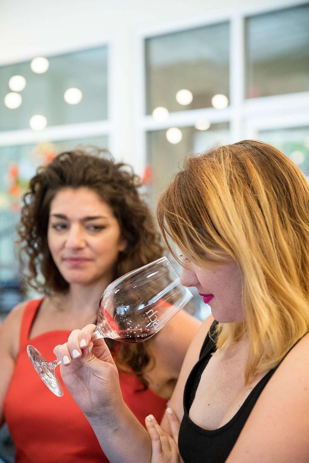 Shana Robinson (left) and Andrea Heap participate in a tasting in the tasting room of Bokisch Vineyards in Lodi, Calif., on Saturday, August 19, 2017. The winery specializes in Spanish varietals and Tizona wines.