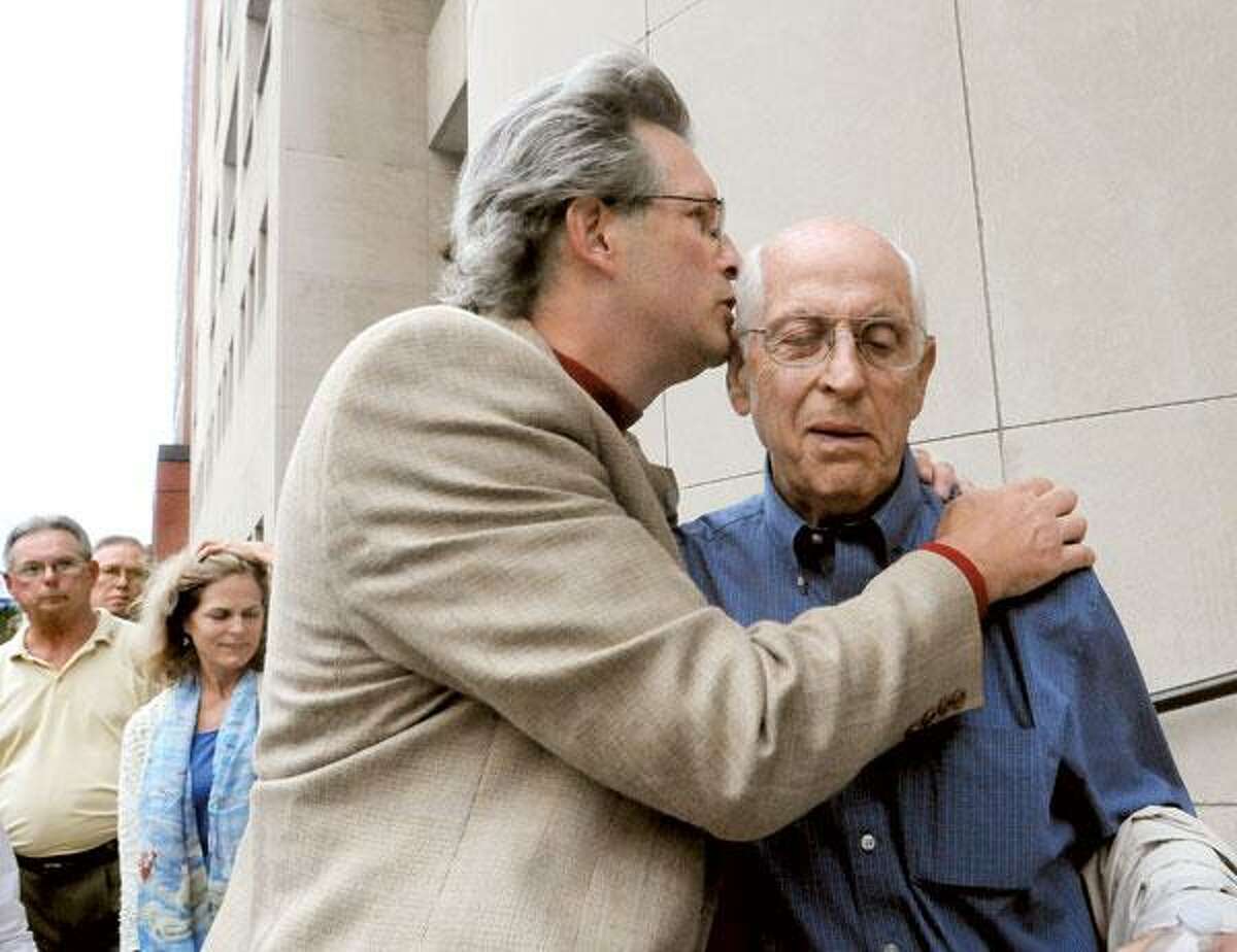 Dr. William Petit Jr., left, kisses his father-in-law, the Rev. Richard Hawke, as the two men spoke Tuesday outside Superior Court in New Haven after the prosecution and defense rested their cases in the trial of Steven J. Hayes. (Melanie Stengel/Register)