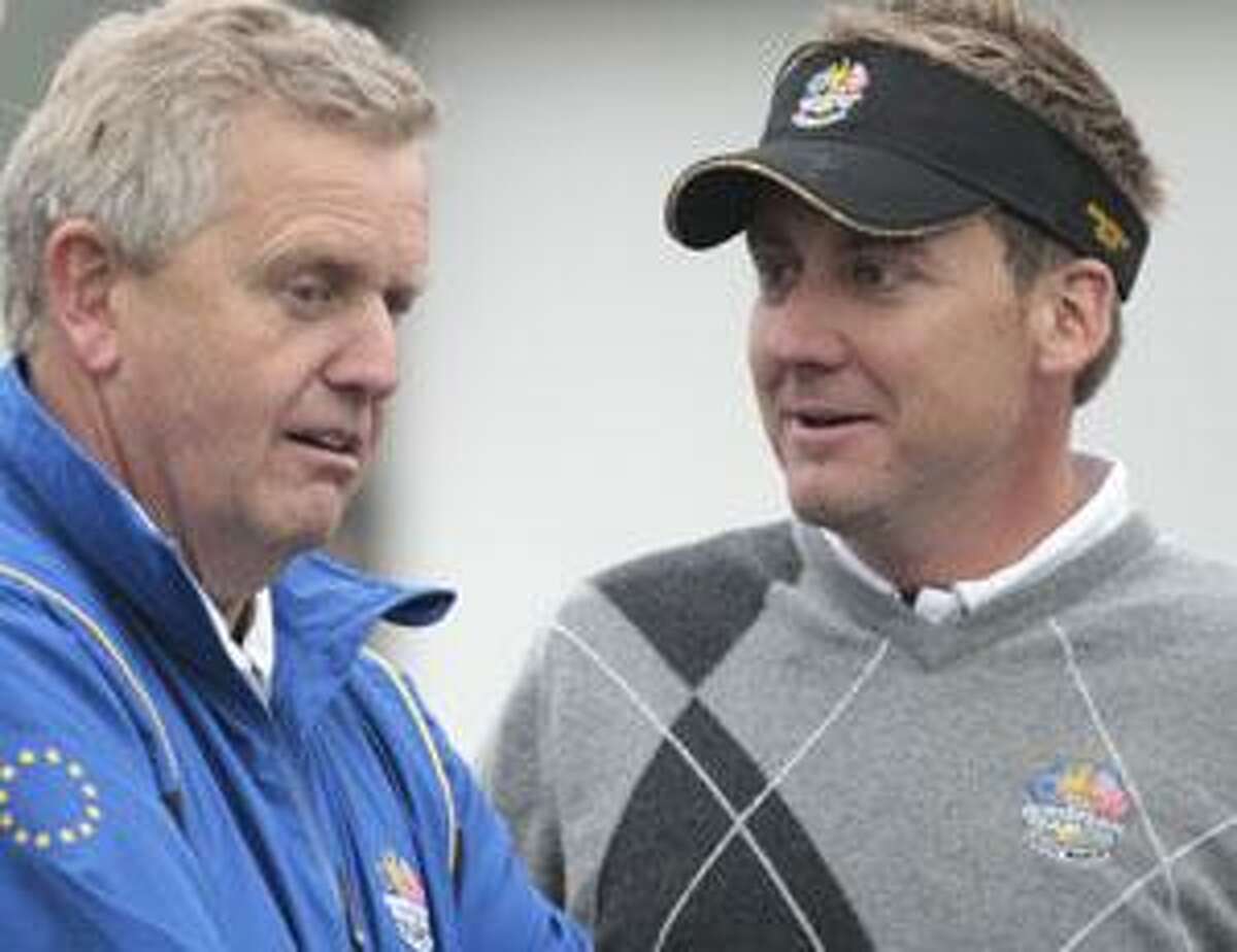 Europe captain Colin Montgomerie, left, talks with team member Ian Poulter during a practice session at the 2010 Ryder Cup golf tournament in Newport, Wales, Tuesday, Sept. 28, 2010. The tournament starts Friday Oct. 1. (AP Photo/Matt Dunham)