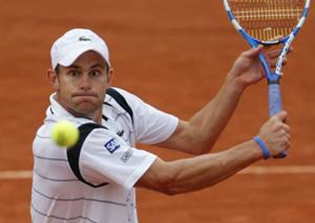 USA's Andy Roddick returns the ball to Slovenia's Blaz Kavcic during their second round match for the French Open tennis tournament at the Roland Garros stadium, Thursday, May 27, 2010 in Paris. (AP Photo/Christophe Ena)