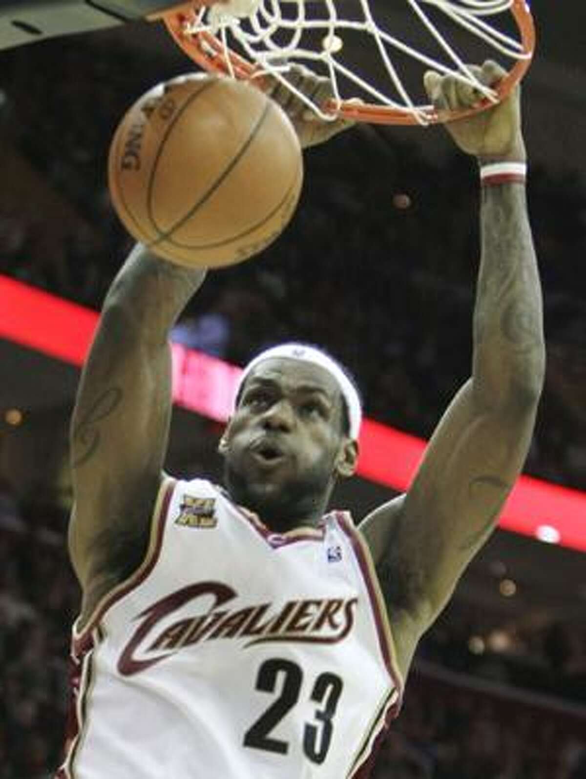 AP Cleveland Cavaliers forward LeBron James dunks the ball in the fourth quarter of a game Tuesday against the Toronto Raptors in Cleveland. James and the Cavs host the Los Angeles Lakers tonight.