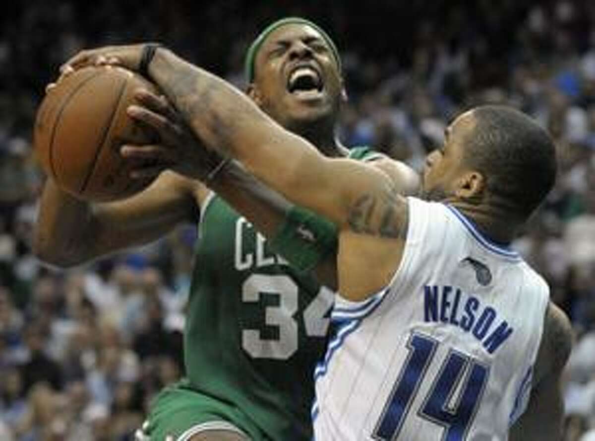 Orlando Magic guard Jameer Nelson, right, strips the ball from Boston Celtics forward Paul Pierce while going up for a shot during the second half in Game 5 of the NBA Eastern Conference finals in Orlando, Fla., Wednesday. The Magic won 113-92. (AP Photo/Phelan M. Ebenhack)