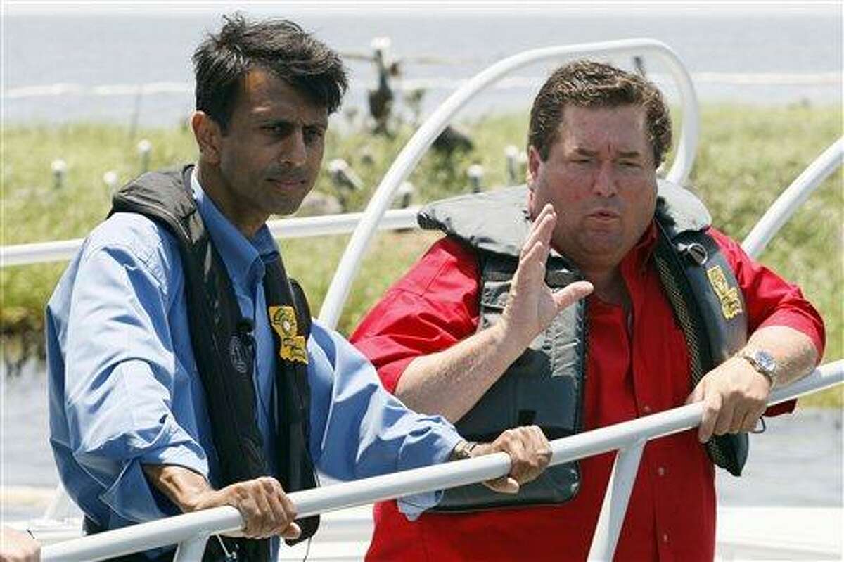 Louisiana Gov. Bobby Jindal, left, and Plaquemines Parish president Billy Nungesser speak while sailing near an island in Barataria Bay on the coast of Louisiana, Sunday, May 23, 2010. The island is home to hundreds of brown pelican nests as well at terns, gulls and roseate spoonbills and is being impacted by oil from the Deepwater Horizon Oil Spill. (AP Photo/Patrick Semansky)