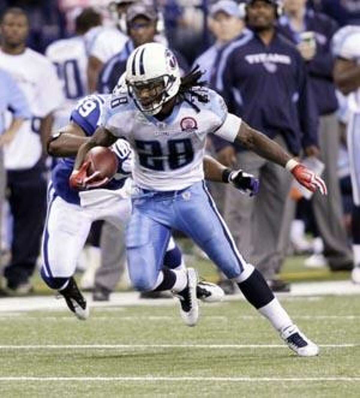 Tennessee Titans running back Chris Johnson (28), left, celebrates