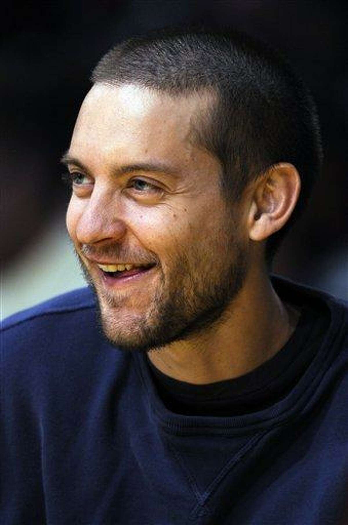 In this Feb. 28, 2008 file photo, actor Toby Maguire watches the Los Angeles Lakers and Miami Heat basketball game at the Staples Center in Los Angeles. The 34-year-old star of the web-slinging Spider-Man superhero franchise said Thursday, pre-production snags aren't dampening his mood about the fourth installment.