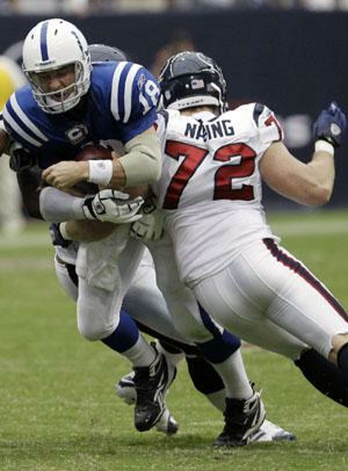 AP Indianapolis Colts quarterback Peyton Manning (18) is sacked by Houston Texans' Jess Nading (72) and another Texan, rear, during the third quarter of a Sept. 12 game in Houston. Manning looked like himself Wednesday. He stood tall, spoke with that down home drawl and answered all the questions. But after last week's loss in Houston, Manning is hoping he can at least stay upright in the pocket Sunday night.