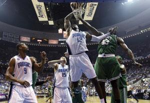 Boston Celtics center Kendrick Perkins, left, battles for a