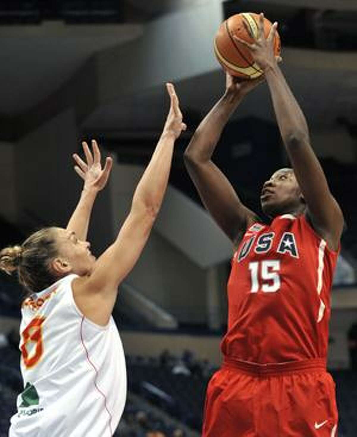 United States' Tina Charles goes up for a shot while guarded by Spain's Lucila Pascua during the second half of an exhibition basketball game in Hartford, Conn., on Sunday, Sept. 12, 2010. (AP Photo/Jessica Hill)
