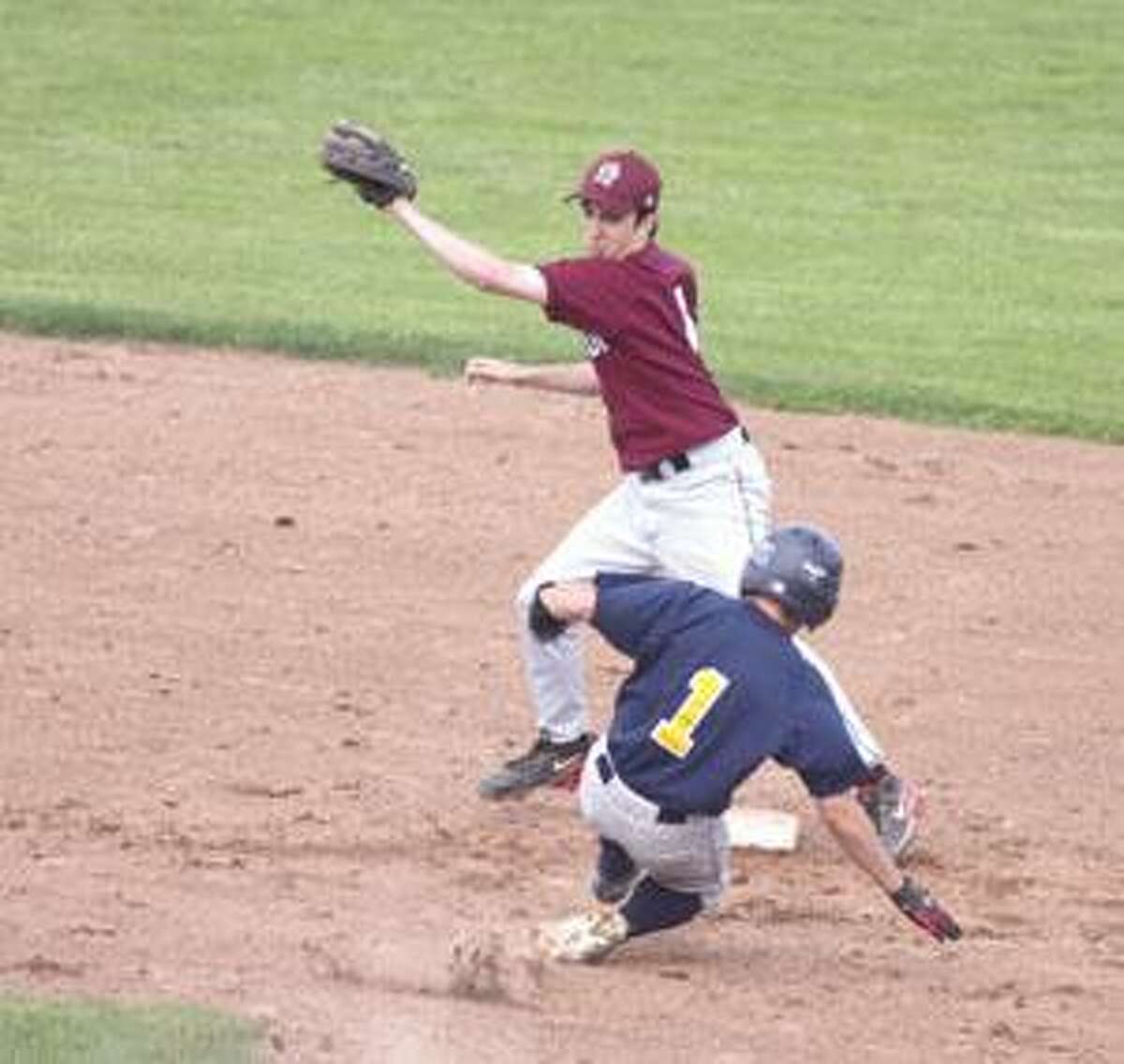 Torrington's Jimmy Fuchsman tries for the tag as Kennedy's James McMahon slides safely into second.