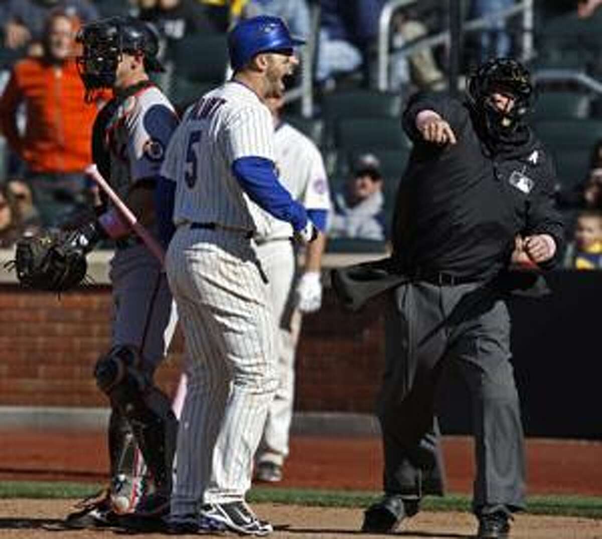 AP Home plate umpire Paul Schrieber, right, ejects New York Mets third baseman David Wright (5) for arguing a called third strike for in the bottom of the ninth inning in the Mets' 6-5 loss to the San Francisco Giants Sunday at Citi Field in New York. Giants catcher Eli Whiteside, left, looks on.