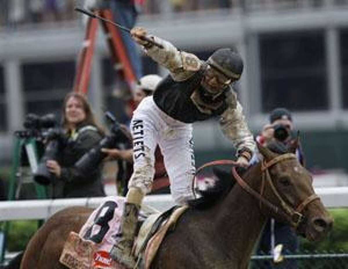 Jockey Calvin Borel celebrates after winning the Kentucky Derby on Mine That Bird during the 135th Kentucky Derby at Churchill Downs Saturday in Louisville, Ky. (AP Photo/Ed Reinke)