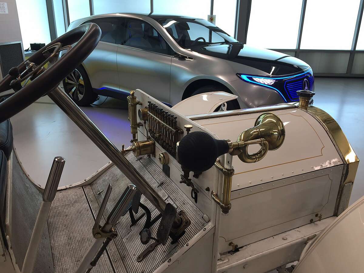 Two Mercedes on temporary display at the Mercedes-Benz Sunnyvale research lab. In the foreground, the 1902 Mercedes Simplex, in the background, the Concept EQ electric concept car.