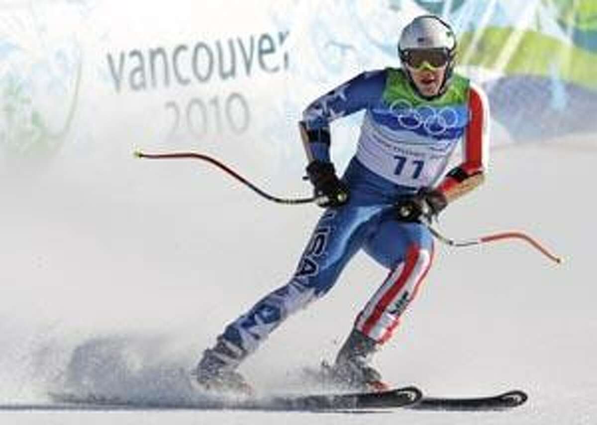 Bode Miller of the United States finishing the Men's super-G at the Vancouver 2010 Olympics in Whistler, British Columbia, Friday, Feb. 19, 2010. (AP Photo/Sergey Ponomarev)