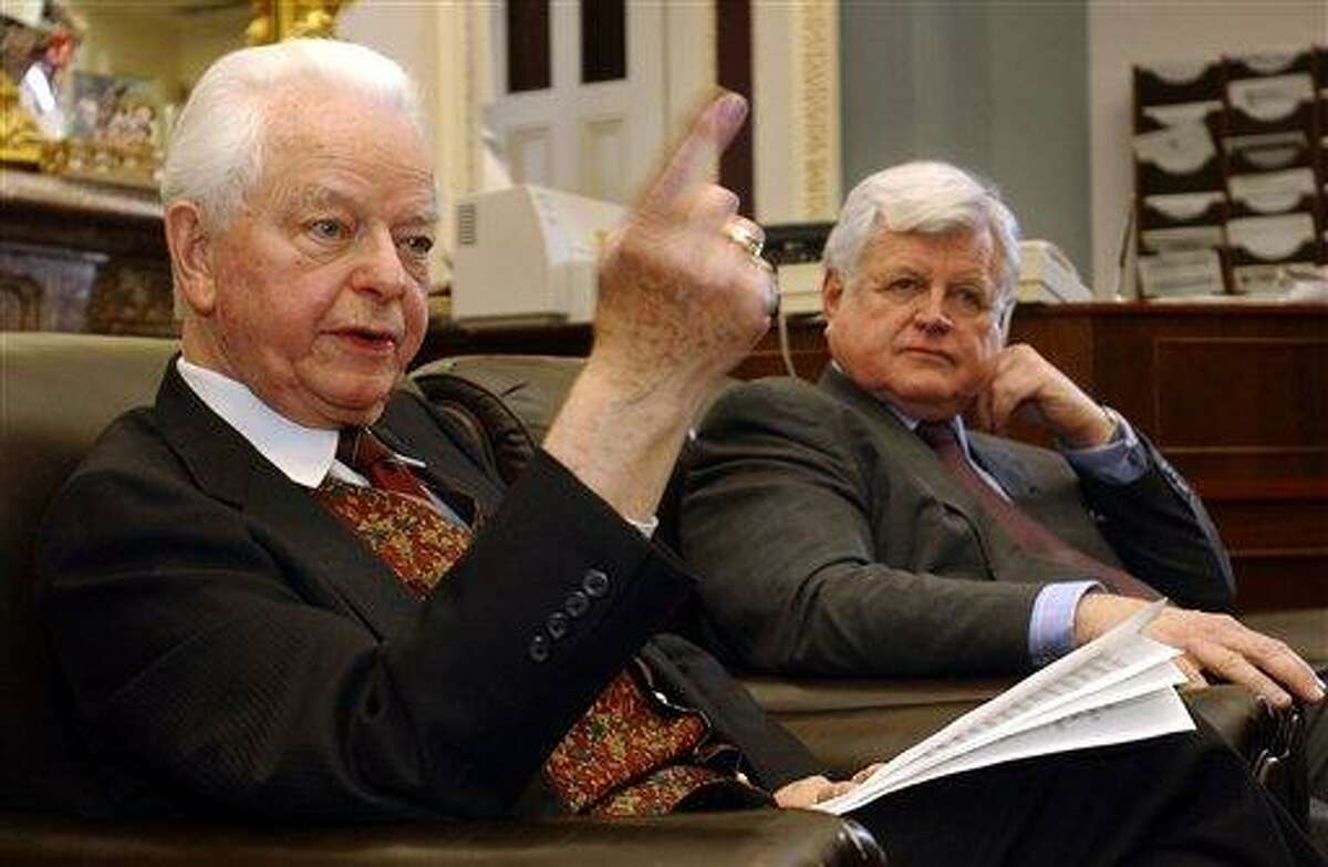 FILE - In this Jan. 30, 2003 file photo, Sen. Robert Byrd, D-W.Va, left, and Sen. Edward Kennedy, D-Mass., talk to reporters on Capitol Hill to discuss the situation in Iraq. Byrd a fiery orator versed in the classics and a hard-charging power broker who steered billions of federal dollars to the state of his Depression-era upbringing, died Monday, June 28, 2010. (AP Photo/Susan Walsh, File)