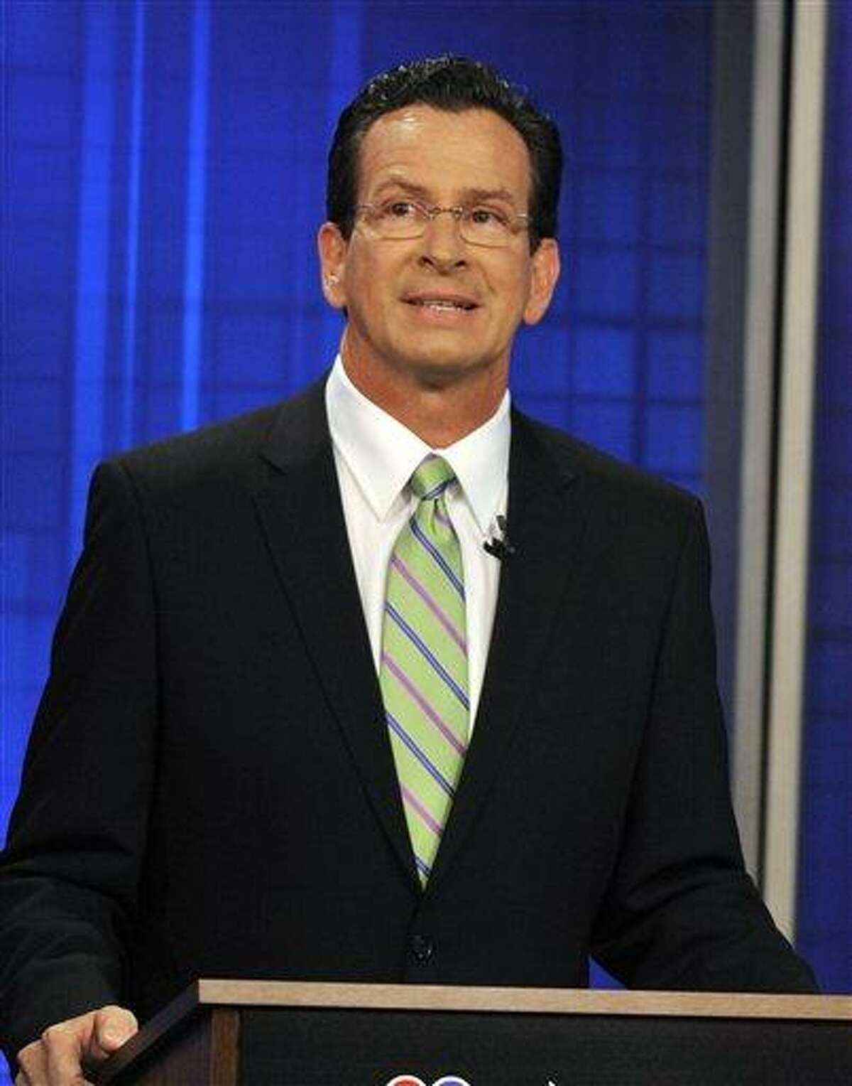 Democratic candidate for governor Dan Malloy stands at a podium during a commercial break for a live televised debate against Ned Lamont in West Hartford, Conn., on Tuesday, June 22, 2010. (AP Photo/Jessica Hill)
