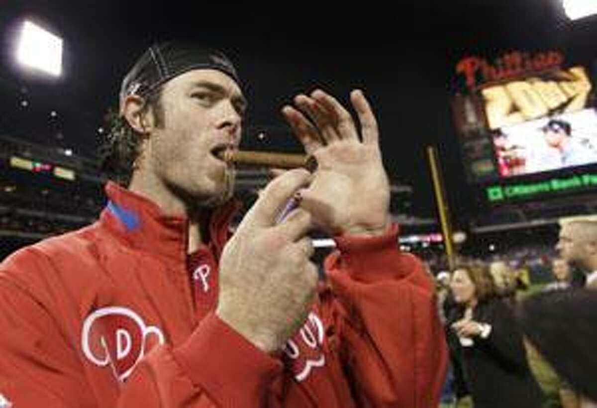 AP Philadelphia Phillies outfielder Jayson Werth lights a cigar on the field after the Phillies beat the Los Angeles Dodgers 10-4 in Game 5 to win the National League pennant Thursday in Philadelphia.