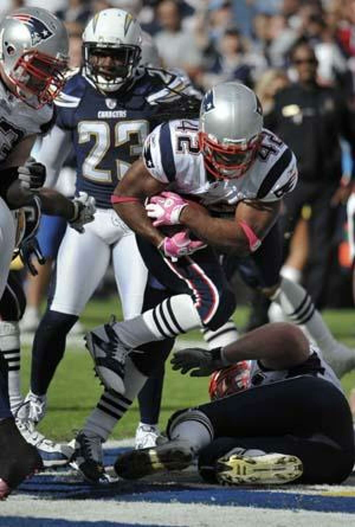 New England Patriots running back BenJarvus Green-Ellis runs in to the end zone for a touchdown against the San Diego Chargers in the second half during an NFL football game Sunday, Oct. 24, 2010, in San Diego. (AP Photo/Denis Poroy)