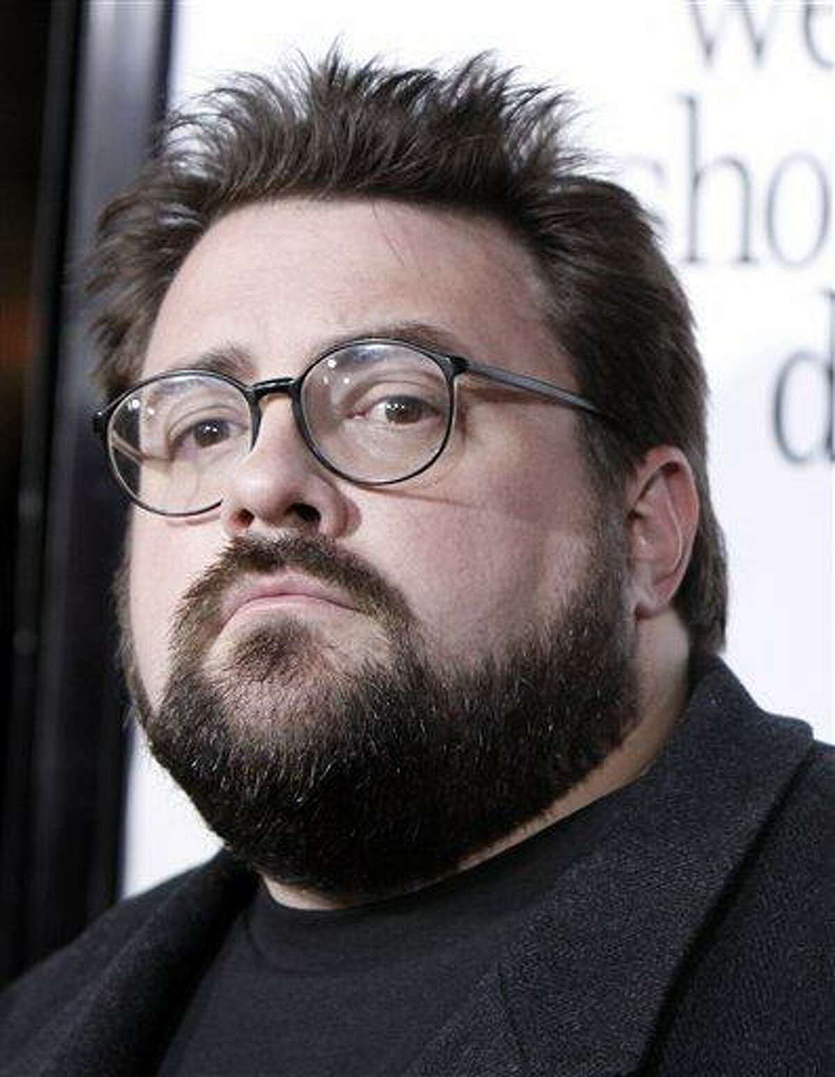 FILE - In this Oct. 20, 2008 file photo Kevin Smith arrives at the premiere of "Zach and Miri Make A Porno" in Los Angeles. (AP Photo/Matt Sayles, File)