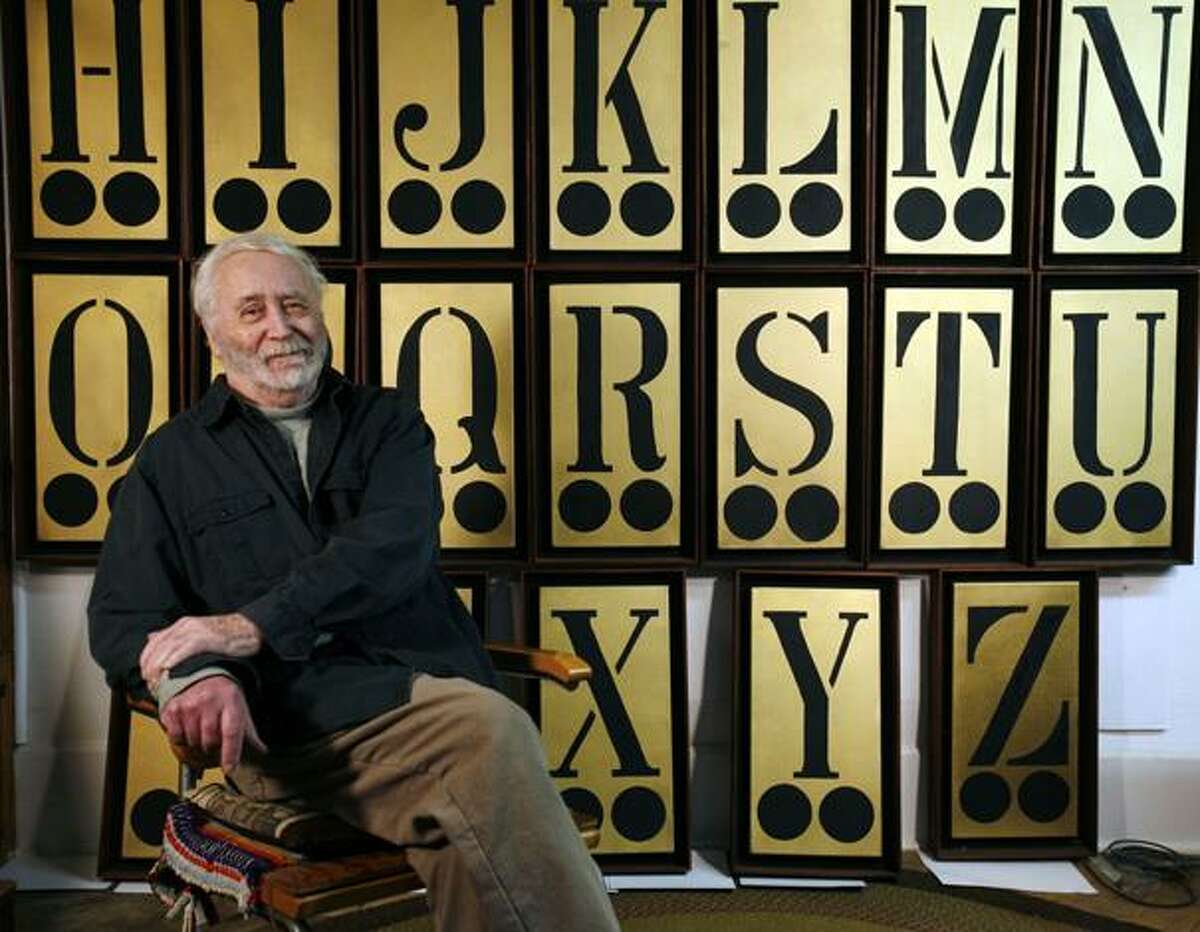Pop artist Robert Indiana, 80, poses in front of his alphabet art piece at his home on Vinalhaven Island, Maine, on Thursday, May 14, 2009. The Farnsworth Museum in Rockland, Maine will open an exhibit of Indiana's work titled, "The Robert Indiana and The Star of Hope exhibition," which runs June 20-Oct. 25, 2009. (AP Photo/Pat Wellenbach)