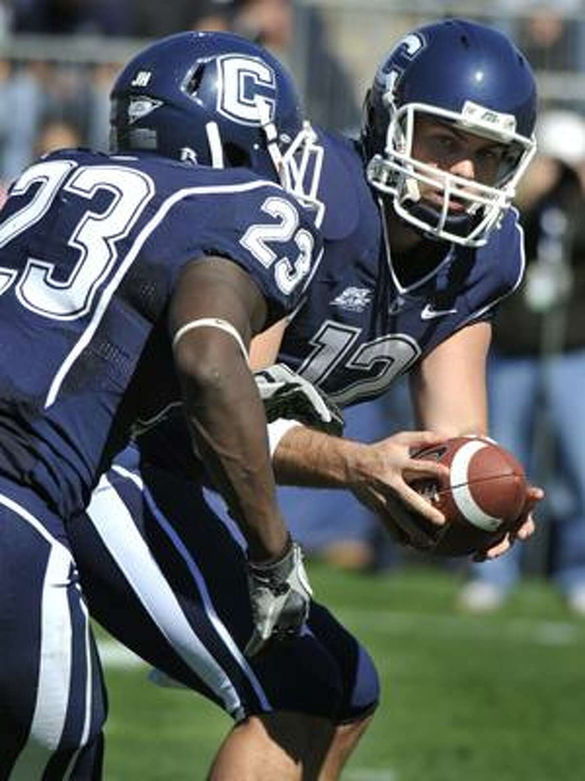 Connecticut quarterback Cody Endres, right, hands off to Jordan Todman (23) during the first half of a NCAA college football game against Vanderbilt in East Hartford, Conn., on Saturday, Oct. 2, 2010.(AP Photo/Jessica Hill)