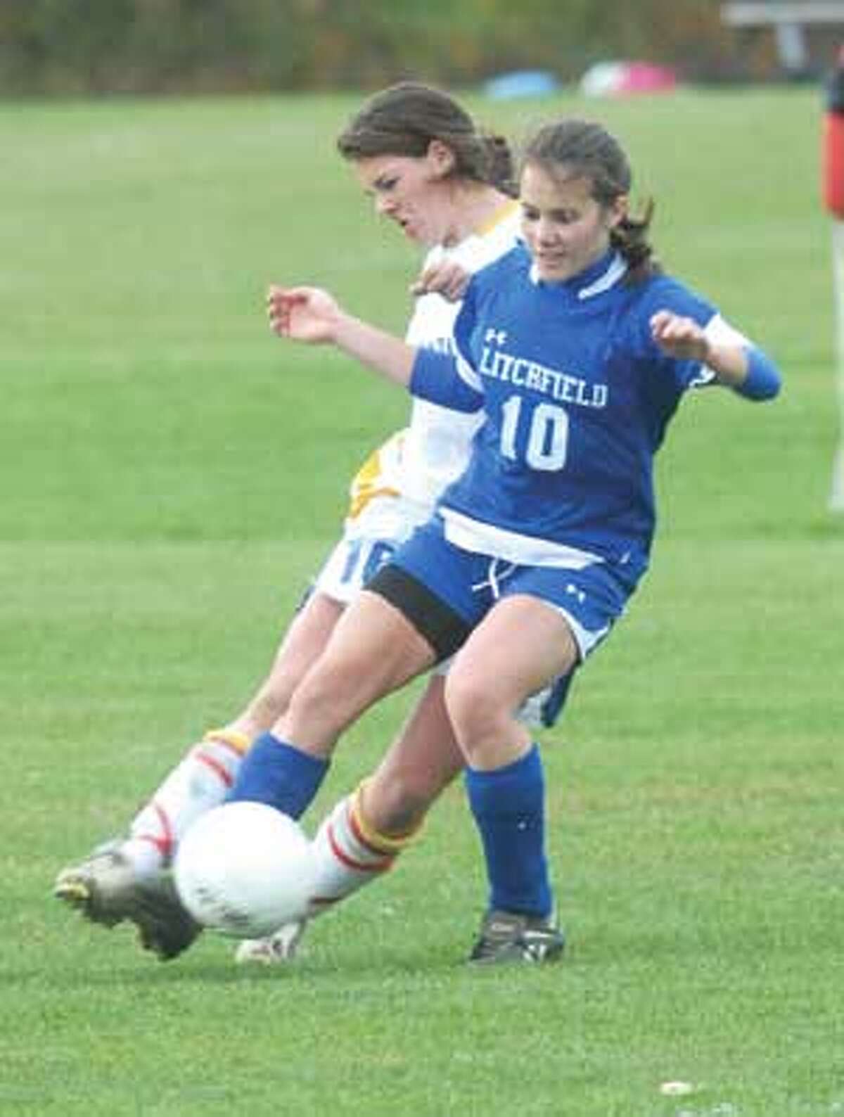 MIC NICOSIA/Register Citizen Housatonic's Katherine Eldridge, left, and Litchfield's Brittany Quinion battle for the ball during Wednesday's game in Falls Village. Purchase a glossy print of this photo and more at www.registercitizen.com.