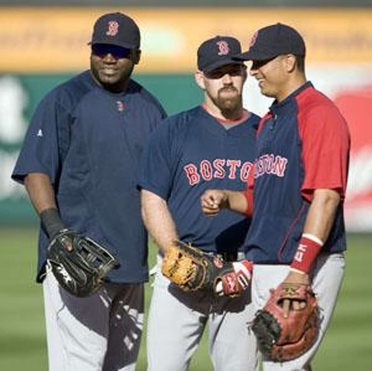 AP Boston Red Sox designated hitter David Ortiz, left, first baseman Kevin Youkilis and catcher Victor Martinez chat during practice Tuesday in Anaheim, Calif., ahead of the team's upcoming American League division series against the Los Angeles Angels.