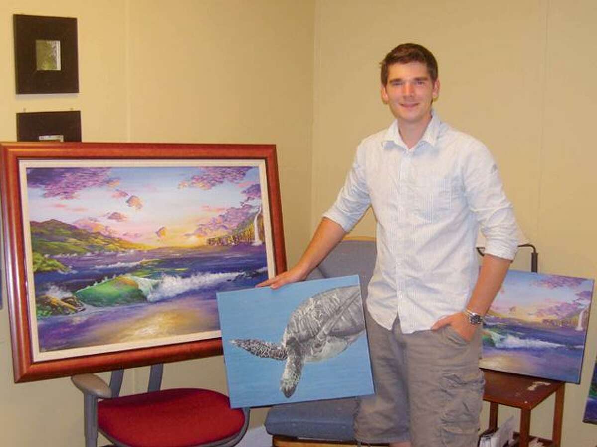 Ryan Christenson, 22, seen here with his paintings, has much to offer the art world in the way of his artistic talent.