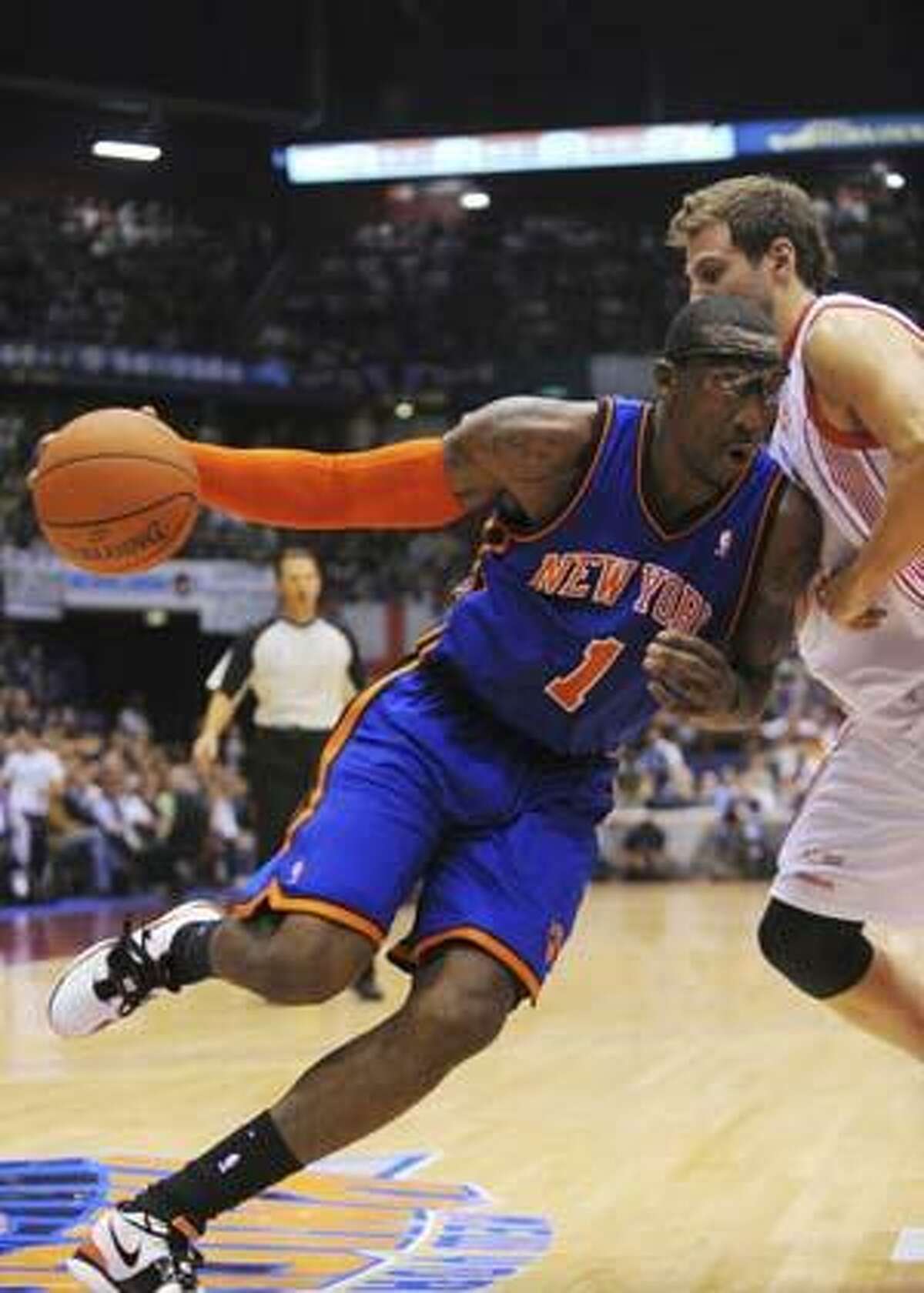 New York Knicks forward Amar'e Stoudemire in action during the New York Knicks' preseason opener against Italian team Olimpia Milano. in Milan, Italy, Sunday, Oct. 3, 2010. (AP Photo/Claudio Scaccini)