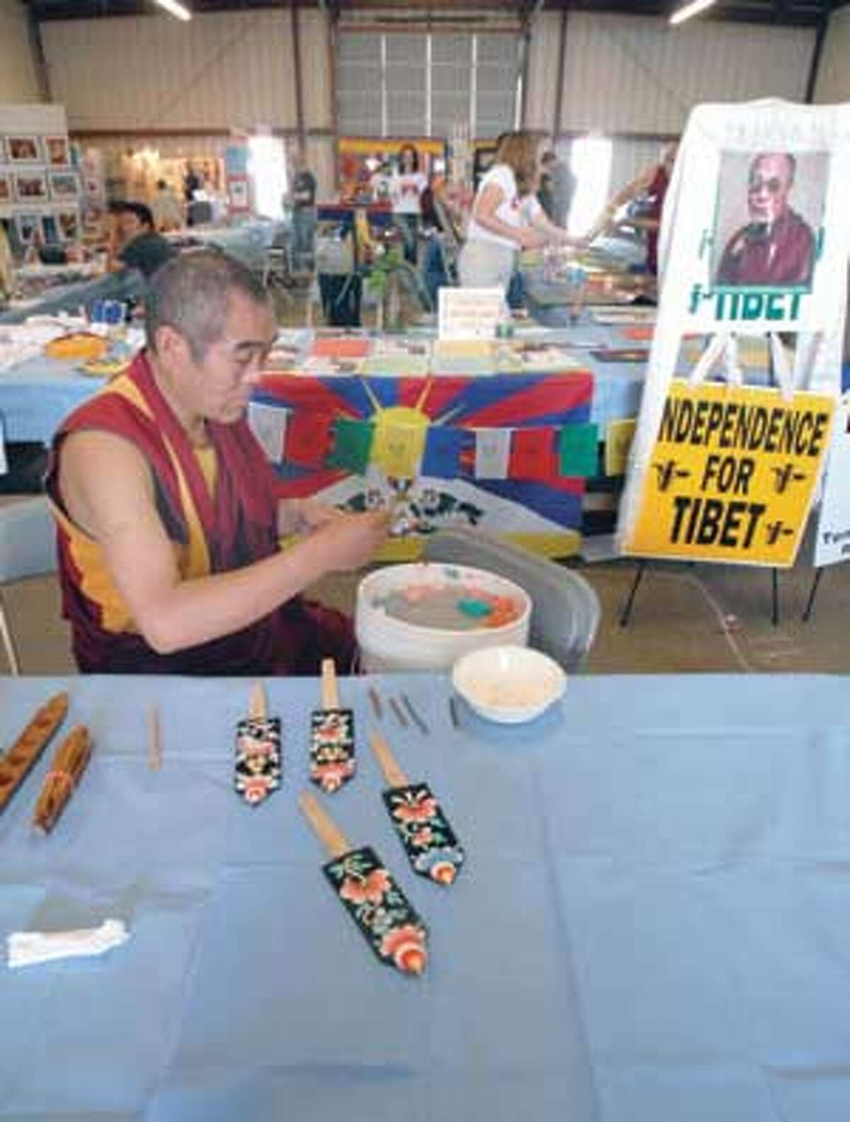 Dhonden Norbu of the Gyudmed Monastery creates butter sculptures at the festival.