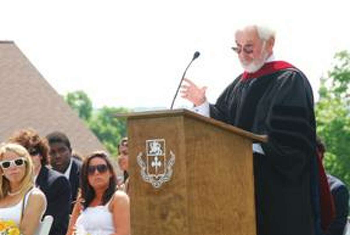 RONALD DeROSA/Register CitizenAcclaimed director and producer Norman Jewison delivers the commencement address to students at The Forman School in Litchfield on Saturday. Jewison, whose resume includes work on Moonstruck and Jesus Christ Superstar, told the students not to be mired in the lures of technology and media and to appreciate the simple things in life.