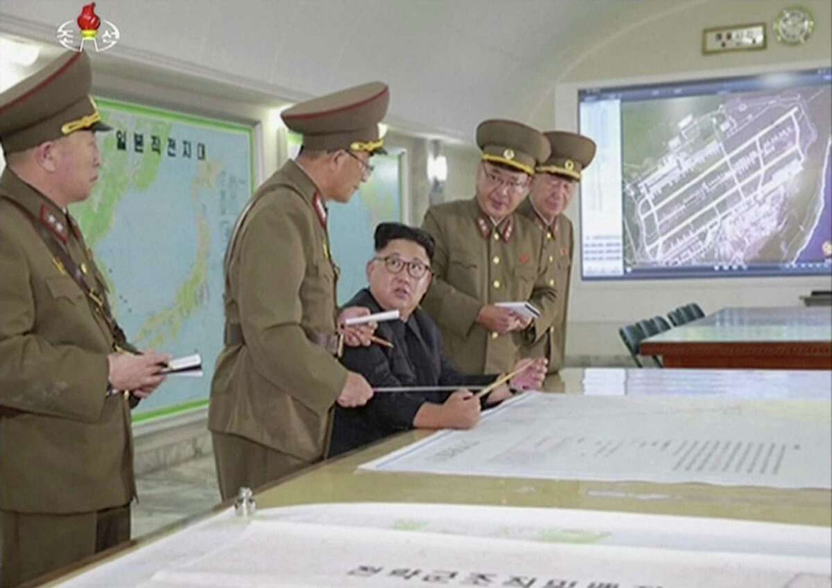 North Korean leader Kim Jong Un receives a briefing in Pyongyang on Aug. 14. Foreign policy failures over the past several decades have given North Korea more time for weapons development.