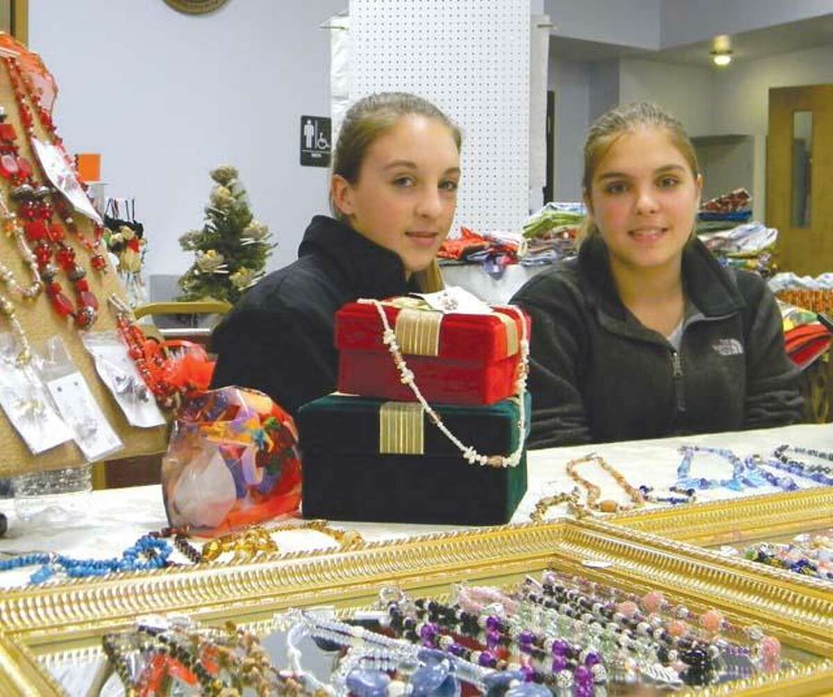 MIKE AGOGLIATI/ Register CitizenTwins Shelby and Taylor Howe created handmade jewelry and sold it at the Sullivan Senior Center's annual craft fair and bake sale. The girls are raising money for a school trip to Washington D.C.