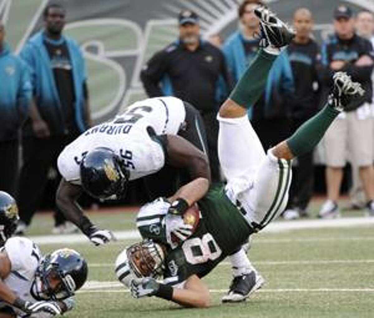 New York Jets tight end Dustin Keller (81) is tackled by Jacksonville Jaguars linebacker Justin Durant (56) during the third quarter Sunday in East Rutherford, N.J.