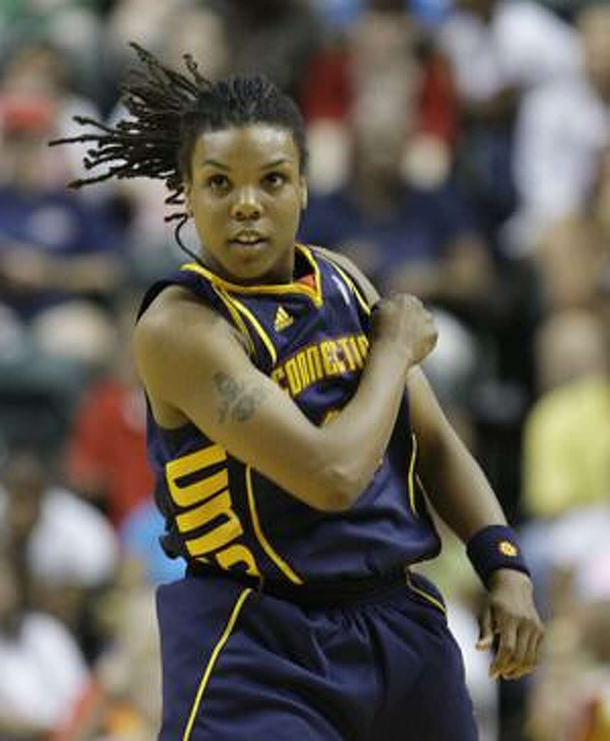 AP Connecticut Sun's Tan White reacts after hitting a shot during the fourth quarter of a game against the Indiana Fever in Indianapolis, Wednesday. Connecticut won 77-68.