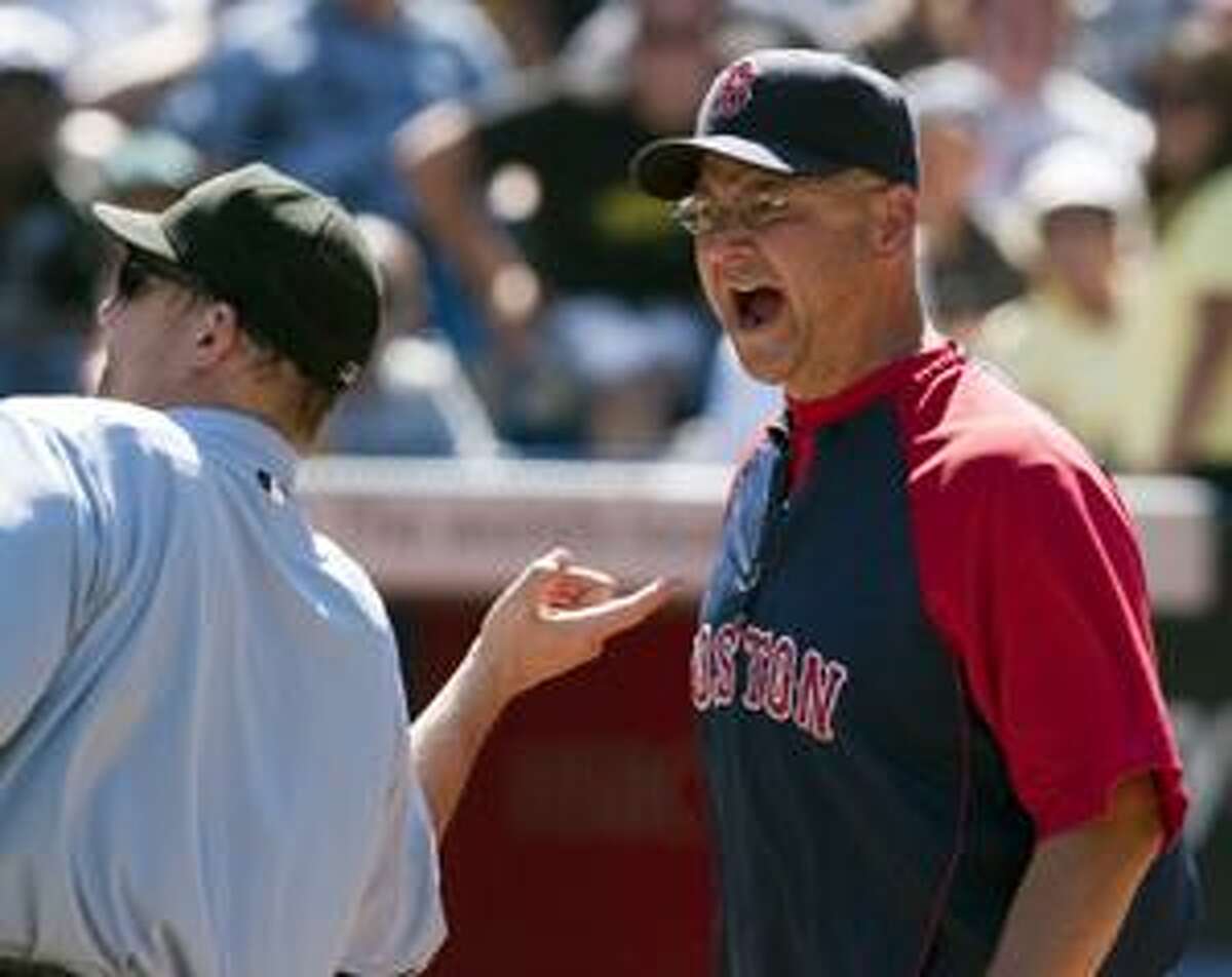 Manager Terry Francona of the Boston Red Sox argues with an umpire