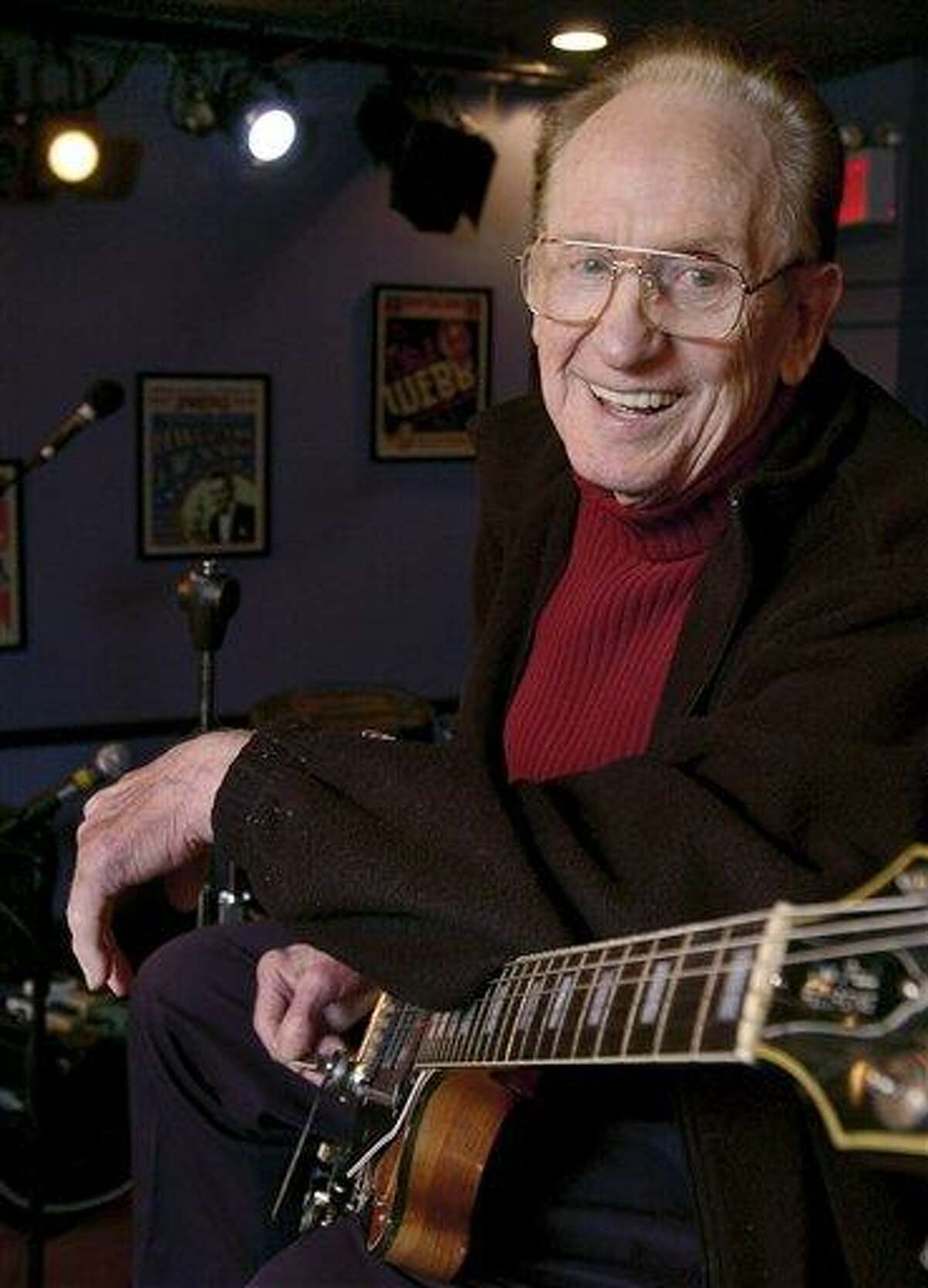 FILE - In this Oct. 4, 2004 file photo, guitar legend Les Paul gets ready to rehearse at the Iridium Jazz Club in New York. Paul, 94, the guitarist and inventor who changed the course of music with the electric guitar and multitrack recording and had a string of hits, died, Thursday, Aug. 13, 2009 in White Plains, N.Y., according to Gibson Guitar. (AP Photo/Richard Drew, file)