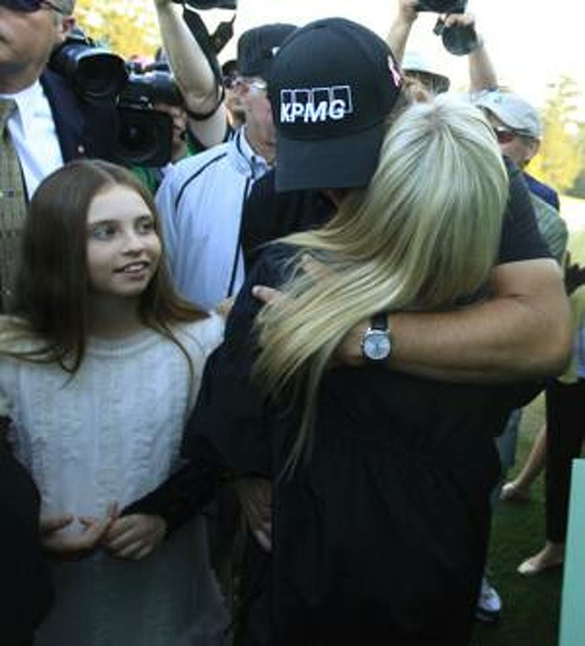 MASTERS Mickelson wins third green jacket, then has a long embrace with wife