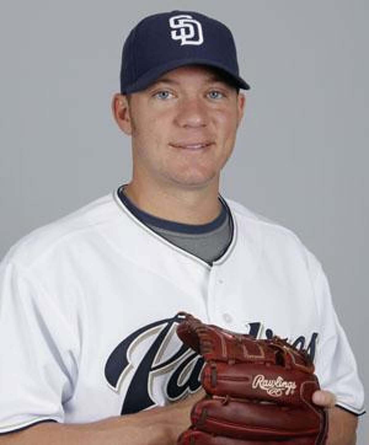 In this Feb. 24, 2009, file photo, San Diego Padres pitcher Jake Peavy poses for a photo in Peoria, Ariz. The Padres traded Peavy to the Chicago White Sox on Friday shortly before the deadline for making deals without waivers. (AP Photo/Charlie Riedel,file)