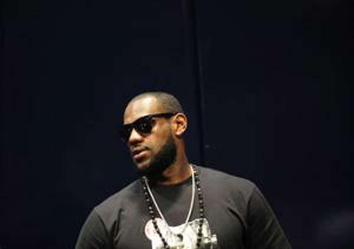 LeBron James attends a scrimmage by the U.S. national basketball team at Radio City Music Hall, Thursday, Aug. 12, 2010, in New York. The scrimmage was followed by a Jay-Z performance. (AP Photo/Stephen Chernin)
