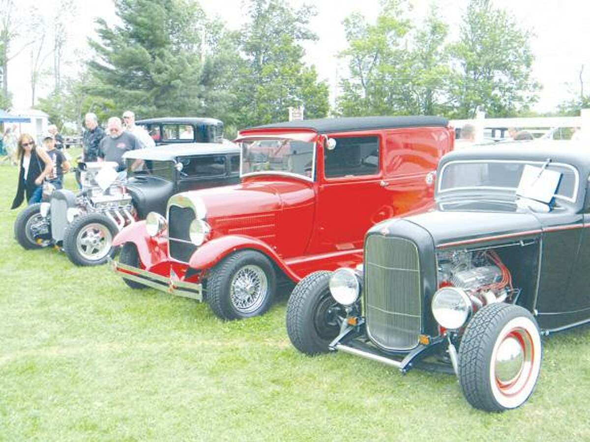 MIKE AGOGLIATI/ Register CitizenThree hot rods are displayed as part of the 35th Annual Litchfield Hills Historical Auto Club car show and swap meet on Sunday at the Gosen Fairgrounds.