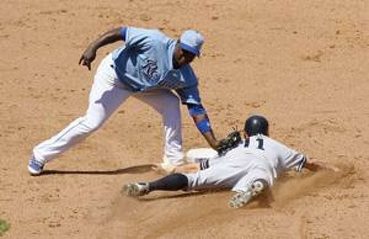 AP Kansas City Royals shortstop Yuniesky Betancourt tags out New York Yankees' Brett Gardner (11) as Gardner tries to steal second in the sixth inning of Sunday's game in Kansas City, Mo.