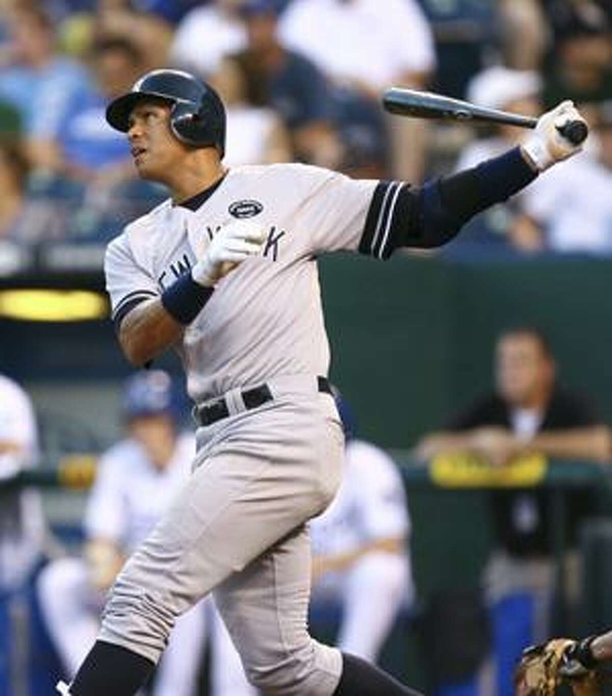 AP New York Yankees third baseman Alex Rodriguez drives the ball over the center field wall for a home run during the sixth inning of Saturday's game against the Kansas City Royals in Kansas City.
