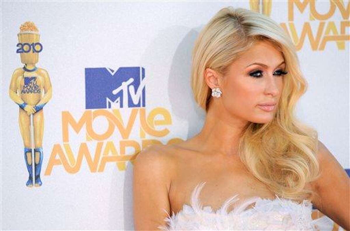 FILE - In this June 6, 2010 photo, Paris Hilton arrives at the MTV Movie Awards in Universal City, Calif. Hilton is being sued for allegedly wearing someone else's hair. A company that manufactures hair extensions sued the socialite in Los Angeles on Wednesday, claiming she breached her contract to wear and promote their product. The lawsuit claims Hilton agreed to wear Hairtech International Inc.'s extensions, but sported the fake locks of a competitor in 2008. (AP Photo/Chris Pizzello)