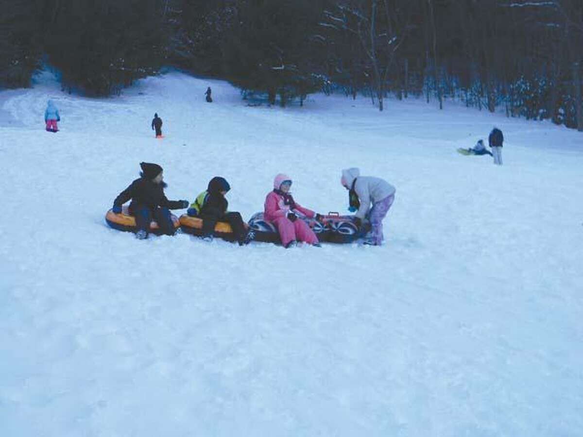 Children and parents alike braved high winds and cold temperatures to sled at Major Besse Park.