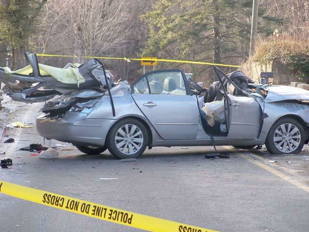 RICKY CAMPBELL/ Register Citizen Two people were killed in a one-car accident Tuesday afternoon on Route 4, in front of 182 Goshen Rd.
